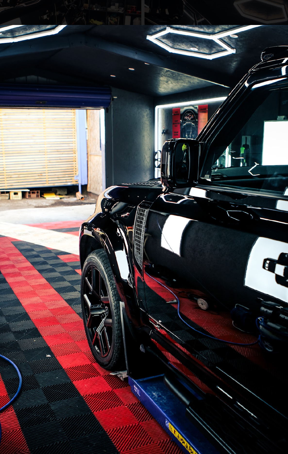 Black Land Rover Defender in the detailing bay at Rotherham